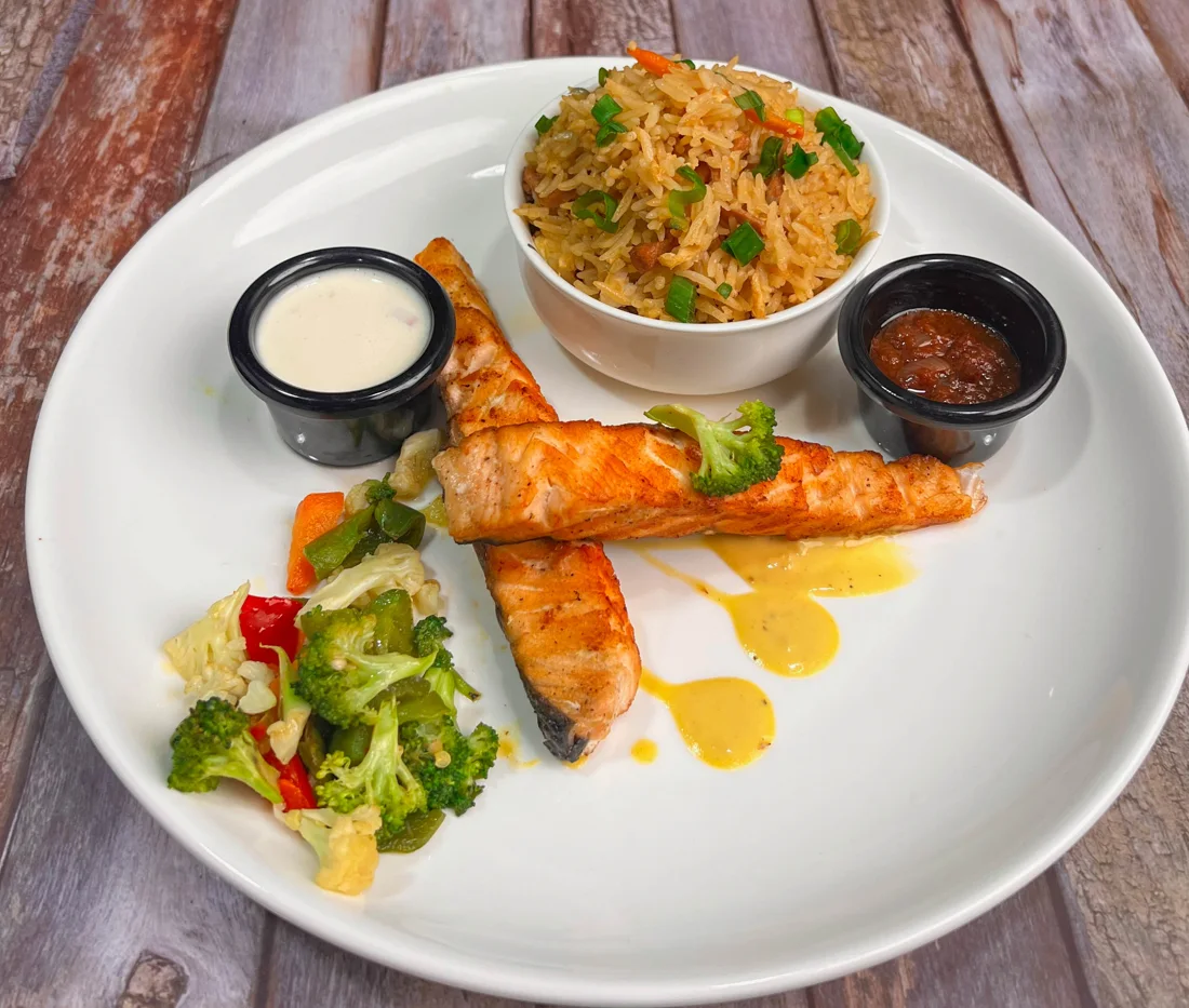 Pan-grilled salmon with rice and vegetables from Crossover’s official menu